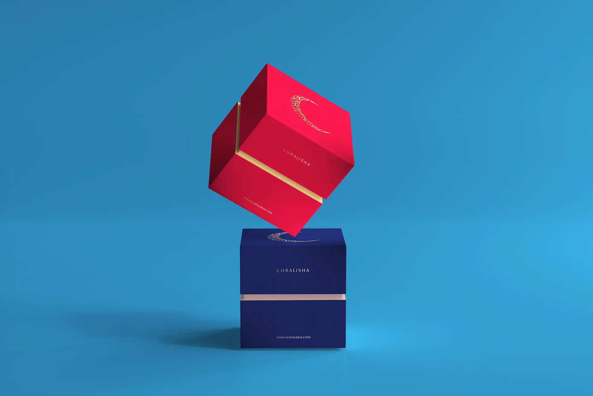cajas corporativas con logotipo en stamping dorado colores azul y rojo sobre fondo azul de Coralisha